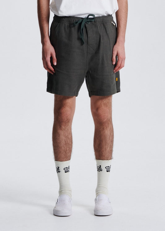 The Critical Slide Society Cruiser Linen Short - Sage, worn by a model, front view