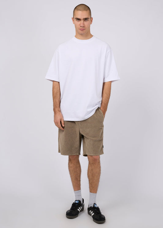 Model wearing the Silent Theory Cord Short in mushroom with a white tee