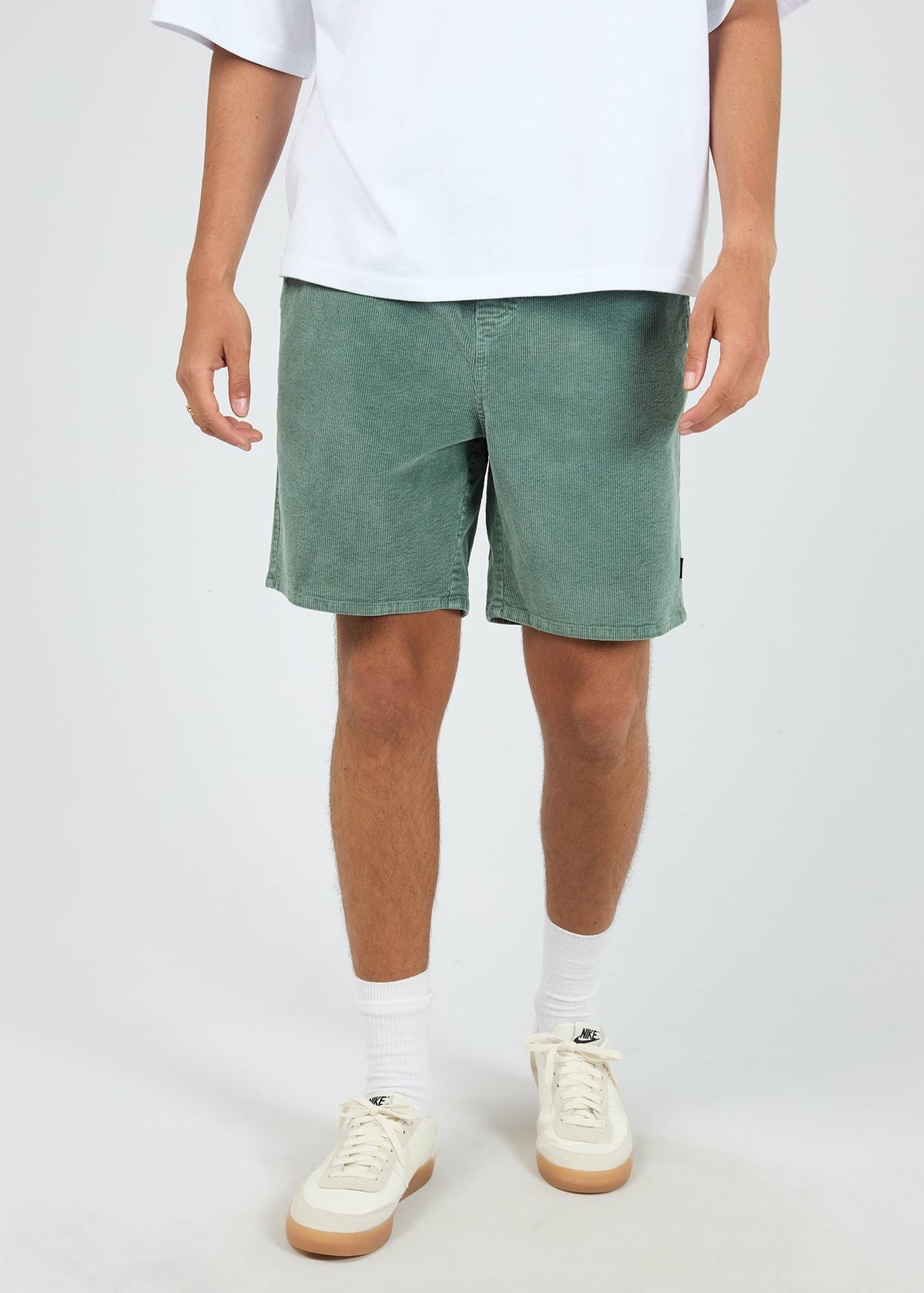 Front of the bottle green corduroy short showing the drawstring waist