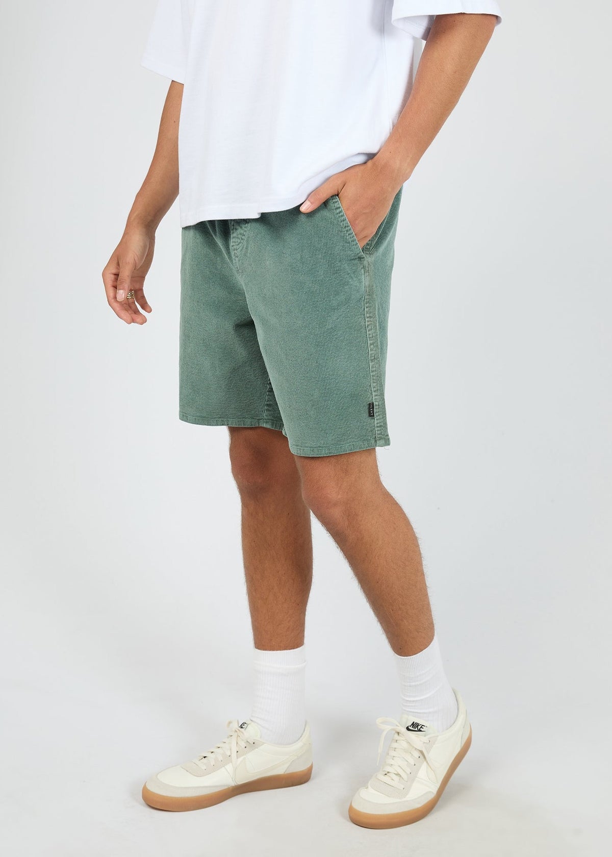 Side pocket detail on the bottle green corduroy short