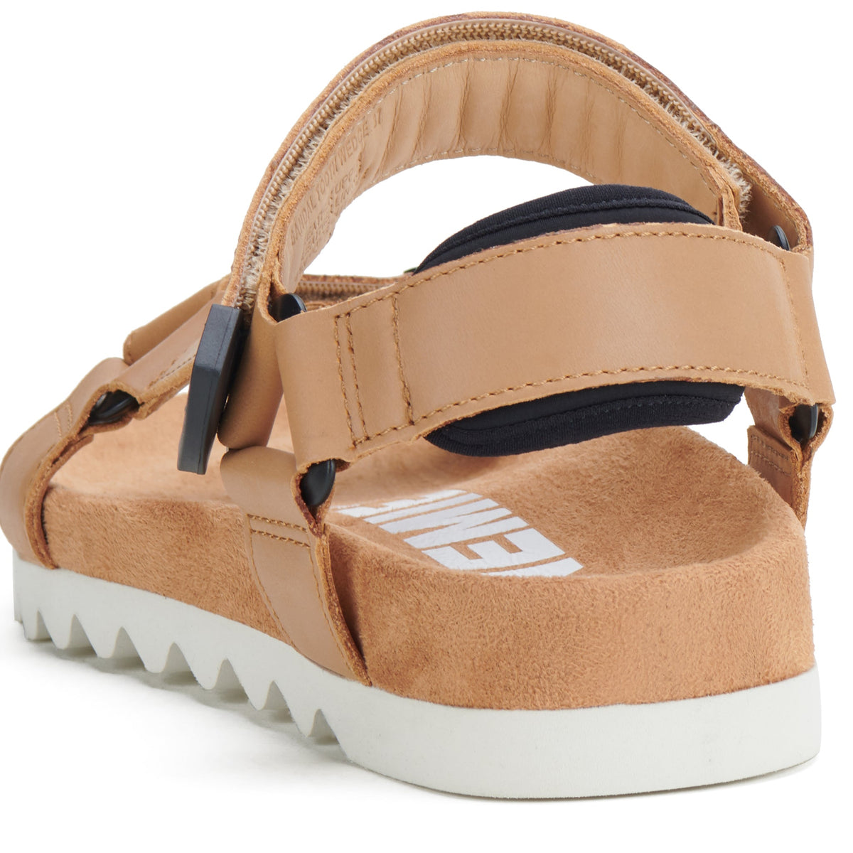 Close view of the padded heel strap and white toothed sole